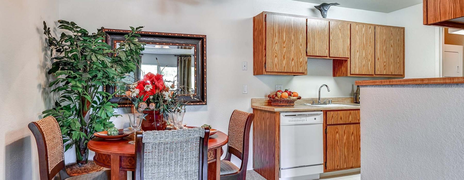a kitchen with a table and chairs
