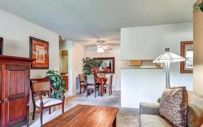 a living room with a table and chairs